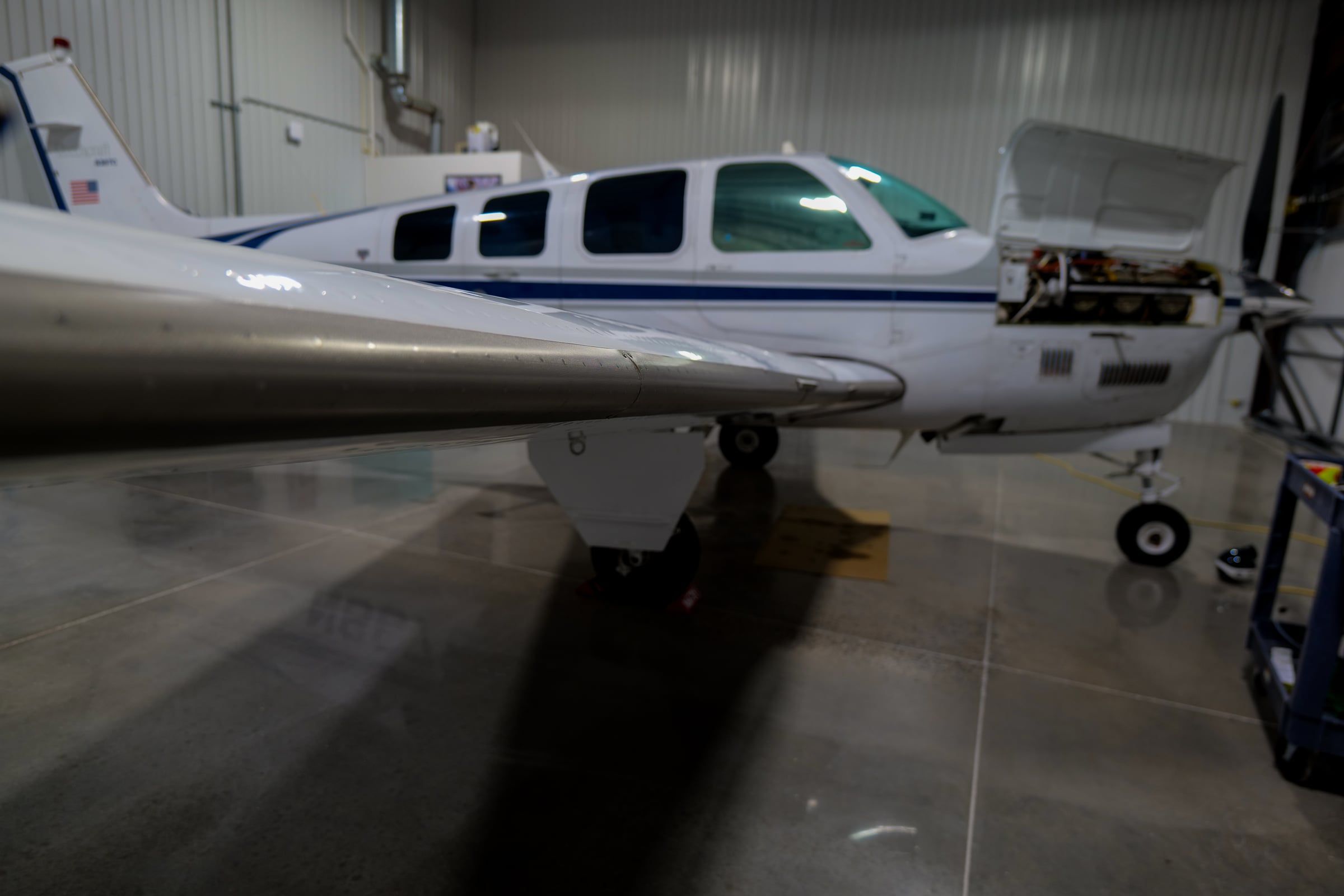 Bonanza with TKS in the hangar
